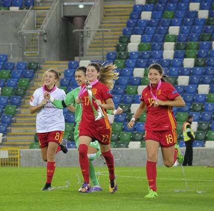 20th August 2017, Windsor Park, Belfast, Northern Ireland; Womens U19s European Championship EM Europameisterschaft Final; Spain versus France; Lucia Garcia of Spain carries the trophy across the pitch joined by teammates Patricia Guijarro and Ana Marcos Moral xNigelxCookex  ActionPlus11919339