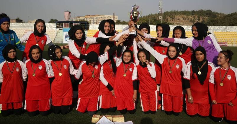 (170824) -- KABUL, Aug. 24, 2017 -- Kabul Club players pose for photos with the trophy at the end of a competition in Kabul, capital of Afghanistan, Aug. 22, 2017. The 21-day women s Premier League organized by the Afghan Football Federation among eight teams, concluded in Kabul on Tuesday and the team of Kabul Club won the title. ) (SP)AFGHANISTAN-KABUL-SOCCER-WOMEN FOOTBALL-PREMIER LEAGUE RahmatxAlizadah 