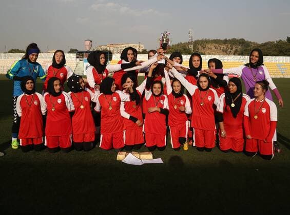 (170824) -- KABUL, Aug. 24, 2017 -- Kabul Club players pose for photos with the trophy at the end of a competition in Kabul, capital of Afghanistan, Aug. 22, 2017. The 21-day women s Premier League organized by the Afghan Football Federation among eight teams, concluded in Kabul on Tuesday and the team of Kabul Club won the title. ) (SP)AFGHANISTAN-KABUL-SOCCER-WOMEN FOOTBALL-PREMIER LEAGUE RahmatxAlizadah 