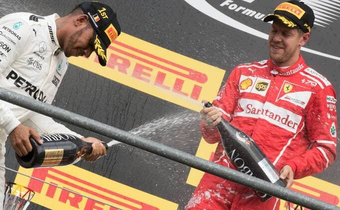 Mercedes British driver Lewis Hamilton and Ferrari s German driver Sebastian Vettel celebrate on the podium after the Spa-Francorchamps Formula One Grand Prix of Belgium race, in Spa-Francorchamps, Sunday 27 August 2017. BENOITxDOPPAGNE  x05153350x