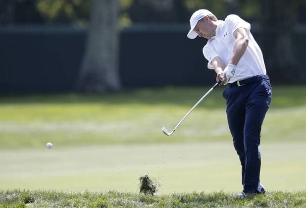 Jordan Spieth hits an iron out of the rough with his approach shot to the first hole green in the final round of The Northern Trust golf championship at the Glen Oaks Club in Old Westbury, New York on August 27, 2017. Glen Oaks Club is hosting THE NORTHERN TRUST for the first time.  NYP20170827105 JOHNxANGELILLO