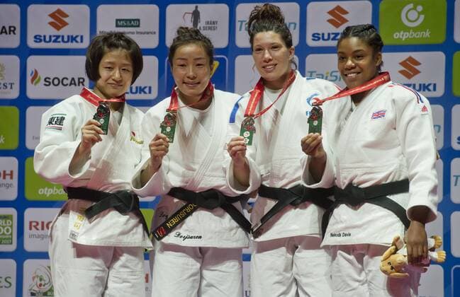 From left: Tsukasa Yoshida of Japan, second place, winner Sumiya Dorjsuren of Mongolia, Helene Receveaux of France and Nekoda Smythe-Davis of Britain, both third place, pose with medals after the women s 57kg category final during the World Judo Championships in Budapest, Hungary, August 30, 2017. (CTKxPhoto VitxSimanek) CTKPhotoP201708300935701  VIS 018