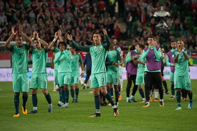 (170904) -- BUDAPEST, Sept. 4, 2017 -- Cristiano Ronaldo (C) of Portugal and his teammates celebrate after winning the 2018 FIFA World Cup WM Weltmeisterschaft Fussball qualification match against Hungary in Budapest, Hungary on Sept. 3, 2017. Portugal defeat Hungary 1-0. ) (SP)HUNGARY-BUDAPEST-FIFA WORLD CUP QUALIFICATION-PORTUGAL VS HUNGARY AttilaxVolgyi 