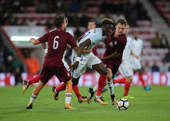 5th September 2017, Vitality Stadium, Bournemouth, England; UEFA European U21 U 21 Championship qualifier, Group 4; England U21 versus Latvia U21; Tammy Abraham of England pushes between Kriss Karkli& x146;s of Latvia and Devids Dobrecovs of Latvia during an England attack xMarkxKertonx  ActionPlus11926345