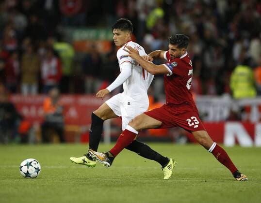 Joaquin Correa of Sevilla and Emre Can of Liverpool during the Champions League Group E match at the Anfield Stadium, Liverpool. Picture date 13th September 2017. Picture credit should read: Simon Bellis Sportimage EDITORIAL USE ONLY. No use with unauthorised audio, video, data, fixture lists, club league logos or live services. Online in-match use limited to 120 images, no video emulation. No use in betting, games or single club league player publications.