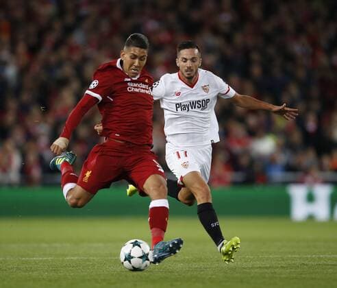 Roberto Firmino of Liverpool gets clear of Pablo Sarabia of Sevilla during the Champions League Group E match at the Anfield Stadium, Liverpool. Picture date 13th September 2017. Picture credit should read: Simon Bellis Sportimage EDITORIAL USE ONLY. No use with unauthorised audio, video, data, fixture lists, club league logos or live services. Online in-match use limited to 120 images, no video emulation. No use in betting, games or single club league player publications.