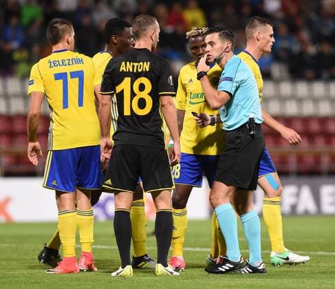 From left Lukas Zeleznik and Ibrahim Benjamin Traore of Zlin, Gheorghe Anton of Tiraspol, Ubong Moses Ekpai of Zlin and referee Andrew Dallas in action during the Football Europa League 1st round group F match: Fastav Zlin vs Sheriff Tiraspol in Olomouc, Czech Republic, September 14, 2017. (CTKxPhoto LudekxPerina) CTKPhotoP201709140954601  LPE 003