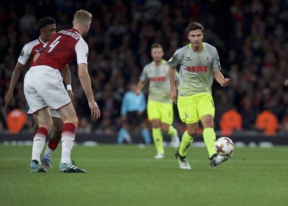 Arsenal v FC Cologne UEFA Champions League Jonas Hector of FC Cologne and Per Mertesacker of Arsenal during the UEFA Champions League match at the Emirates Stadium, London Content Not Available For UK Newspapers Copyright: xAlanxStanfordx FIL-10666-0028