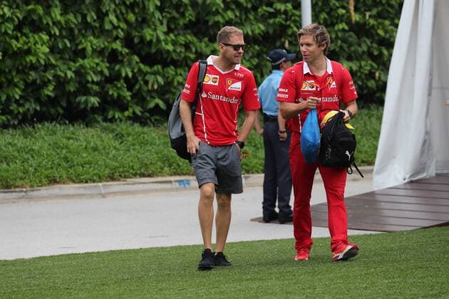 Singapore Grand Prix 14 - 17 September 2017 16.09.2017 - Sebastian Vettel (GER) Scuderia Ferrari SF70H and Antti Kontsas (FIN) Sebastian Vettel Personal Trainer 