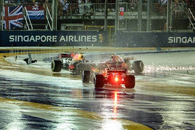 (170917) -- SINGAPORE, Sept. 17, 2017 -- McLaren Honda s Spanish driver Fernando Alonso (Front) crashes with Red Bull Racing Tag Heuer s Dutch driver Max Verstappen (L) and Ferrari s Kimi Raikkonen of Finland during the Formula One Singapore Grand Prix in Singapore on Sept. 17, 2017. ) (wll) (SP)SINGAPORE-FORMULA ONE-SINGAPORE GRAND PRIX-RACE ThenxChihxWey 