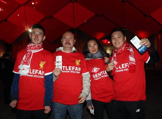 MOSCOW, RUSSIA - SEPTEMBER 26, 2017: Liverpool FC s fans wear T-shirts given to them by Spartak Moscow s fans as part of the Gentlefan. Russian Warm Welcome hospitality programme ahead of the 2017 18 UEFA Champions League Group E Round 2 football match at Otkrytie Arena Stadium. Artyom Korotayev TASS  TS061F9E
