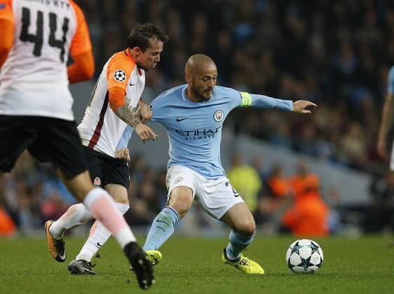 David Silva of Manchester City tackled by Bernard of Shaktar Donetsk during the Champions League Group F match at the Emirates Stadium, Manchester. Picture date: September 26th 2017. Picture credit should read: Andrew Yates Sportimage EDITORIAL USE ONLY. No use with unauthorised audio, video, data, fixture lists, club league logos or live services. Online in-match use limited to 120 images, no video emulation. No use in betting, games or single club league player publications.