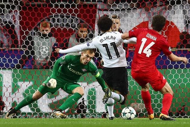 MOSCOW, RUSSIA - SEPTEMBER 26, 2017: Spartak Moscow s goalkeeper Artyom Rebrov, Liverpool s Mohamed Salah, and Spartak Moscowâ€™s Georgi Dzhikia (L-R) in action in their 2017 18 UEFA Champions League Group E Round 2 football match at Otkrytie Arena Stadium. The game ended in a 1-1 draw. Stanislav Krasilnikov TASS  TS06201E