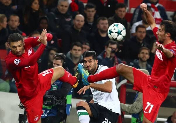 MOSCOW, RUSSIA - SEPTEMBER 26, 2017: Spartak Moscow s Salvatore Bocchetti, Liverpool s Emre Can, and Spartak Moscow s Ivelin Popov (L-R) fight for the ball in their 2017 18 UEFA Champions League Group E Round 2 football match at Otkrytie Arena Stadium. The game ended in a 1-1 draw. Stanislav Krasilnikov TASS  TS062053
