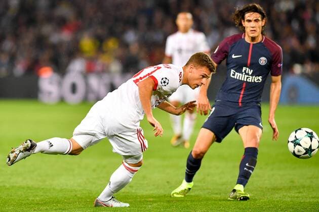 (170928) -- PARIS, Sept. 28, 2017 -- Joshua Kimmich (L) from Bayern Munich tries to shoot during the match against Paris Saint-Germain of Group B of the 2017-18 season Champions League at Parc des Princes in Paris, France on Sept. 27, 2017. Paris Saint-Germain won by 3-0 at home. ) (SP)FRANCE-PARIS-FOOTBALL-CHAMPIONS LEAGUE-PARIS SAINT-GERMAIN VS BAYERN MUNICH ChenxYichen 