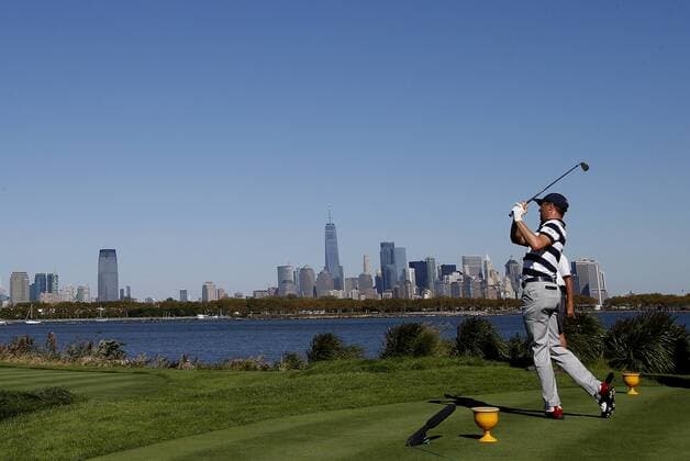 Justin Thomas of the United States tees off on the 10th hole on day one of the Presidents Cup on September 28, 2017 at Liberty National Golf Club in Jersey City, New Jersey.  NYP20170928501 RICHxSCHULTZ