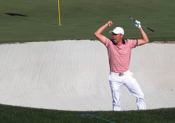 Justin Thomas of the United States reacts after sinking a putt from the bunker on the 14th green on day two of the Presidents Cup on September 29, 2017 at Liberty National Golf Club in Jersey City, New Jersey.  NYP20170929501 RICHxSCHULTZ