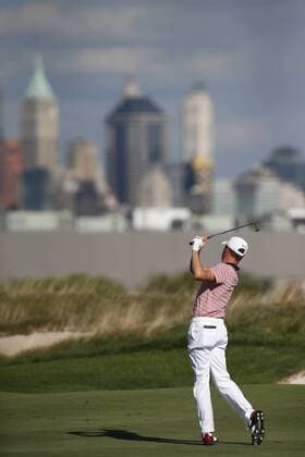 Justin Thomas of the United States hits a shot from the fairway on the 14th on day two of the Presidents Cup on September 29, 2017 at Liberty National Golf Club in Jersey City, New Jersey.  NYP20170929503 RICHxSCHULTZ
