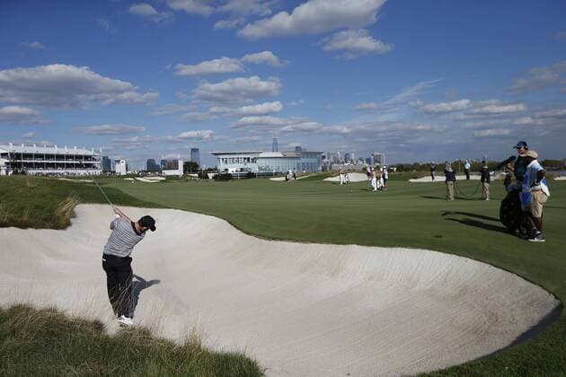 Branden Grace of the International Team his a sjhot from the bunker on the 14th fairway on day two of the Presidents Cup on September 29, 2017 at Liberty National Golf Club in Jersey City, New Jersey.  NYP20170929504 RICHxSCHULTZ