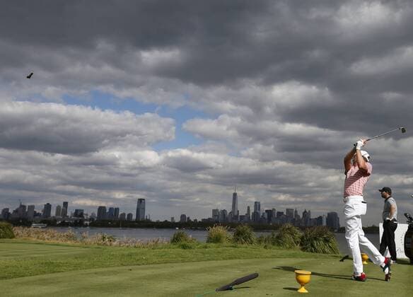 Justin Thomas of the United States hits his tee shot from the 10th hole on day two of the Presidents Cup on September 29, 2017 at Liberty National Golf Club in Jersey City, New Jersey.  NYP20170929515 RICHxSCHULTZ