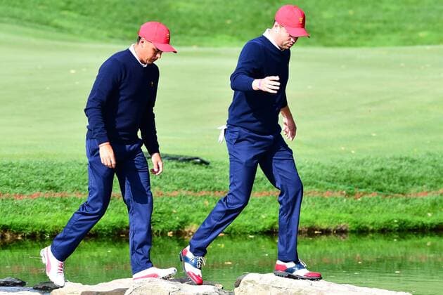 September 30, 2017 - Jersey City, New Jersey, U.S - Rickie Fowler of the US Team(left)j and Justin Thomas of the US Team(right) walk across the stone bridge after the 12th hole during Saturday matches of the Presidents Cup at Liberty National Golf Club in Jersey City, NJ GOLF 2017 - Presidents Cup - ZUMAc119 20170930_zaf_c119_004 Copyright: xBrianxCianciox