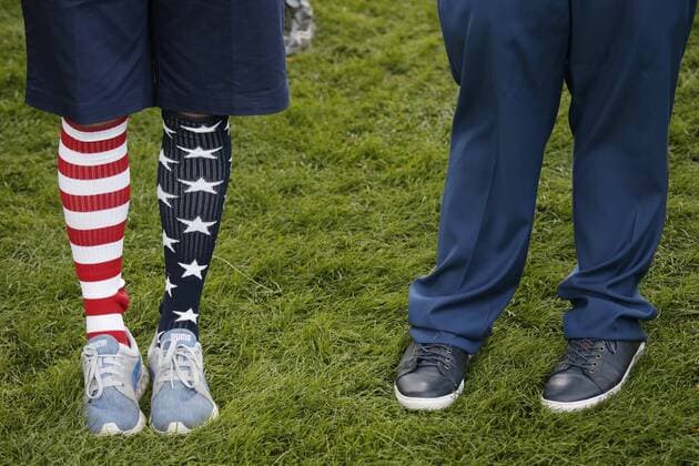 A fan wears American Flag socks and watches the morning foursomes matches at the Presidents Cup on September 30, 2017 at Liberty National Golf Club in Jersey City, New Jersey.  NYP20170930102 JOHNxANGELILLO
