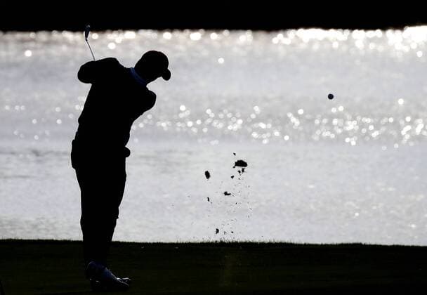 Jordan Spieth of the United States hits his approach shot over water to the 9th green at the Presidents Cup on September 30, 2017 at Liberty National Golf Club in Jersey City, New Jersey.  NYP20170930116 JOHNxANGELILLO
