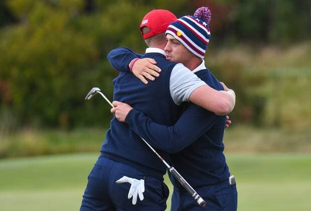 Saturday September 30, 2017: Justin Thomas and Daniel Berger of the United States embrace on the 16th green after winning their fourth round match of the Presidents Cup at Liberty National Golf Course in Jersey City, New Jersey. CSM PGA Golf Herren 2017: Presidents Cup SEPT 30 - ZUMAc04_ 20170930_zaf_c04_242 Copyright: xGregoryxVasilx