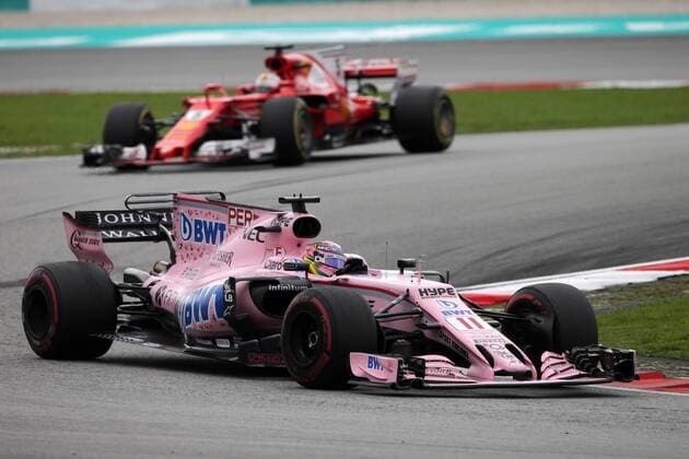 01.10.2017 - Race, Sergio Perez (MEX) Sahara Force India F1 VJM010 leads Sebastian Vettel (GER) Scuderia Ferrari SF70H Malaysian Grand Prix, Sepang 28 September - 1 October 2017 01.10.2017 - Race, Sergio Perez (MEX) Sahara Force India F1 VJM010 leads Sebastian Vettel (GER) Scuderia Ferrari SF70H 