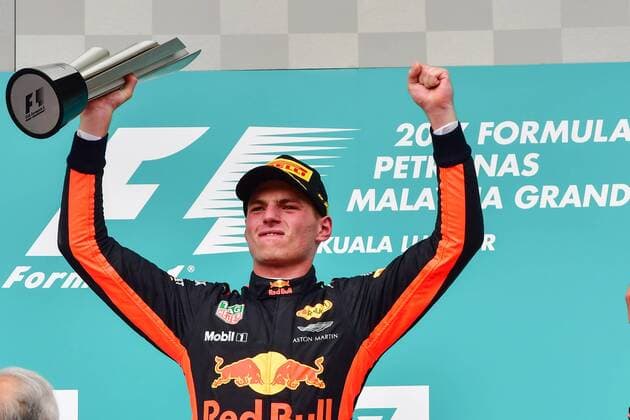 (171001) -- SEPANG, Oct. 1, 2017 -- Red Bull driver Max Verstappen of the Netherlands celebrates on the podium after the Formula One Malaysia Grand Prix at the Sepang Circuit in Malaysia, on Oct. 1, 2017. Max Verstappen claimed the title of the event. ) (SP)MALAYSIA-SEPANG-F1 ChongxVoonxChung 
