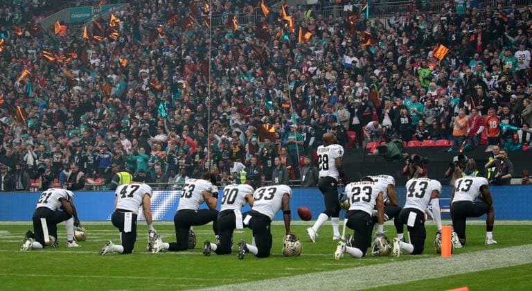 New Orleans Saints players kneel down before the national anthem in the NFL American Football Herren USA International Series match against the Miami Dolphins at Wembley Stadium, London on October 1, 2017. New Orleans beat Miami 20-0. Photo by Hugo Philpott UPI Miami Dolphins Vs New Orleans Saints  - ZUMALPHI 80317417st Copyright: xHUGOxPHILPOTTx