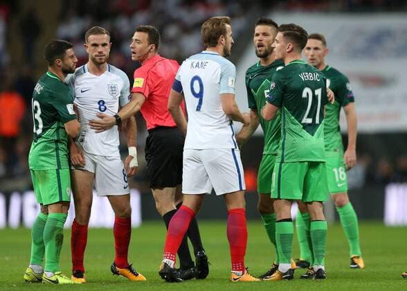 5th October 2017, Wembley Stadium, London, England; FIFA World Cup WM Weltmeisterschaft Fussball Qualification, England versus Slovenia; Harry Kane, the England captain squares up to Bostjan Cesar of Slovenia after a rough challenge on Jordan Henderson of England as Referee Felix Zwayer (GER) attempts to calm all players involved  ActionPlus11937827