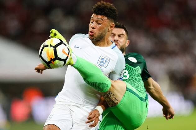 England s Alex Oxlade-Chamberlain and Slovenia?s Bojan Jokic during the World Cup Qualifying - European - Group F match at Wembley Stadium, London. Picture date 5th October 2017. Picture credit should read: Charlie Forgham-Bailey Sportimage EDITORIAL USE ONLY. No use with unauthorised audio, video, data, fixture lists, club league logos or live services. Online in-match use limited to 120 images, no video emulation. No use in betting, games or single club league player publications.