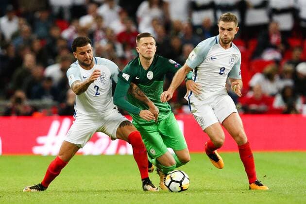 England s Kyle Walker and England s Jordan Henderson tackle SloveniaÕs Josep Ilicic during the World Cup Qualifying - European - Group F match at Wembley Stadium, London. Picture date 5th October 2017. Picture credit should read: Charlie Forgham-Bailey Sportimage EDITORIAL USE ONLY. No use with unauthorised audio, video, data, fixture lists, club league logos or live services. Online in-match use limited to 120 images, no video emulation. No use in betting, games or single club league player publications.