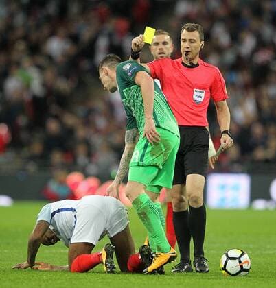 England v Slovenia 2018 FIFA World Cup WM Weltmeisterschaft Fussball Qualifying Valter Birsa of Slovenia gets a yellow card from Referee Felix Zwayer for his foul on Raheem Sterling of England during the 2018 FIFA World Cup Qualifying match at Wembley Stadium, London, UK. Content Not Available For UK Newspapers Copyright: xPaulxChestertonx FIL-10770-0094