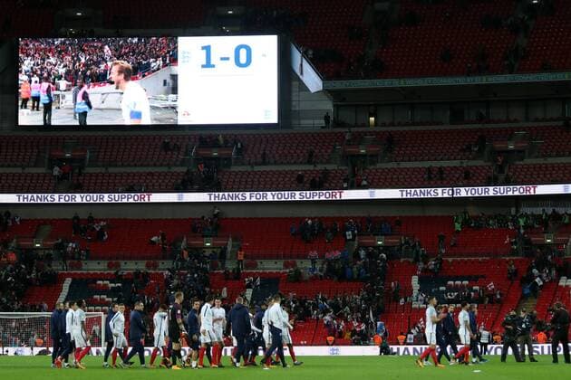 England players and staff do a lap of honour, after qualifying for the World Cup, in front of an almost empty stadium at the England v Slovenia FIFA World Cup WM Weltmeisterschaft Fussball Qualifier 2018 match at Wembley Stadium, London, on October 5, 2017. 