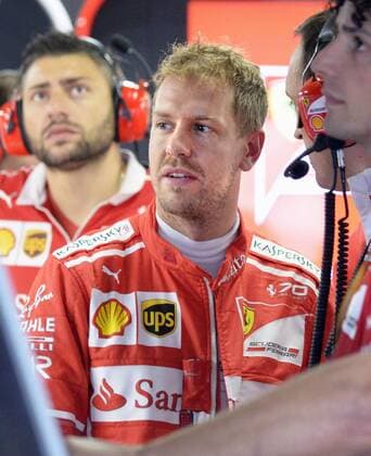 motor racing Motorsport Vettel at Japanese Grand Prix Ferrari ace Sebastian Vettel (2nd from L) of Germany clocks in the fastest time during a practice session for the Japanese Formula One Grand Prix at the Suzuka Circuit in Suzuka, Mie Prefecture, on Oct. 6, 2017. 