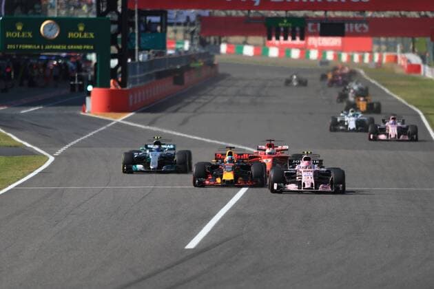 8th October 2017, Suzuka Circuit, Suzuka, Japan; Japanese Formula One Grand Prix, Sunday Race Day; Esteban Ocon - Sahara Force India passes Daniel Ricciardo and Vettel  ActionPlus11939013