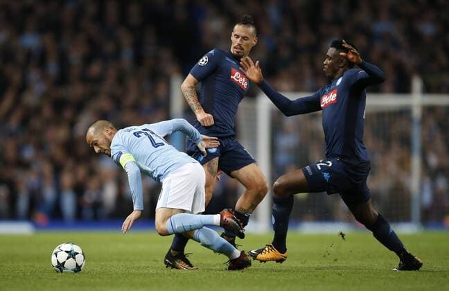 David Silva of Manchester City twist away from Marek Hamsik and Amadou Diawara of Napoli during the champions league match at the Etihad Stadium, Manchester. Picture date 17th October 2017. Picture credit should read: Simon Bellis Sportimage EDITORIAL USE ONLY. No use with unauthorised audio, video, data, fixture lists, club league logos or live services. Online in-match use limited to 120 images, no video emulation. No use in betting, games or single club league player publications.