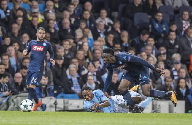 17th October 2017, Etihad Stadium, Manchester, England; UEFA Champions League, Manchester City versus Napoli; Raheem Sterling of Manchester City goes down under challenge from Amadou Diawara of Napoli  ActionPlus11941179