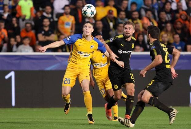 (171018) -- NICOSIA, Oct. 18, 2017 -- Apoel s Roland Sallai (L) vies for the ball during the 2017-2018 Champions League match against Bortussia Dortmund in Nicosia, Cyprus, Oct. 17, 2017. The match tied 1-1. ) (SP)CYPRUS-NICOSIA-SOCCER-UEFA CHAMPIONS LEAGUE-BORTMUND VS APOEL SakisxSavvides 