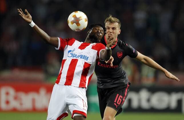 (171020) -- BELGRADE, Oct. 20, 2017 -- Crvena Zvezda s Richmond Boakye (L) vies with Arsenal s Rob Holding during UEFA Europa League match between Crvena Zvezda and Arsenal in Belgrade, Serbia on Oct 19. 2017. Arsenal won 1-0. ) (SP)SERBIA-BELGRADE-SOCCER-UEFA-EUROPA LEAGUE-CRVENA ZVEZDA VS ARSENAL PredragxMilosavljevic 