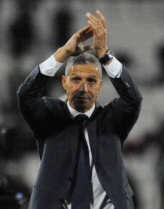 Football - 2017 2018 Premier League - West Ham United vs. Brighton & Hove Albion Brighton Manager, Chris Hughton salutes the fans after the match at The London Stadium. COLORSPORT ANDREW COWIE 