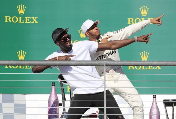 AUSTIN, TX - OCTOBER 22: Retired Jamacian sprinter Usain Bolt (l) and race winner Lewis Hamilton perform Bolt s signature move after the United States Grand Prix on October 22, 2017, at the Circuit of The Americas in Austin, TX. (Photo by David John Griffin Icon Sportswire) AUTO: OCT 22 F1 - United States Grand Prix Icon9531710220688 EDITORIAL USE ONLY