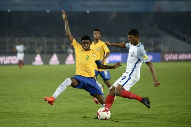 India: England and Brazil Semi Final match England Rhain Brewster (jersey 9) and Brazil Vitao (jersey 3) in action during the FIFA U 17 World Cup India 2017 Semi Final match in Kolkata. Players of England and Brazil in action during the FIFA U 17 World Cup India 2017 Semi Final match on October 25, 2017 in Kolkata. Kolkata West Bengal India Kolkata  SaikatxPaulx xPacificxPress