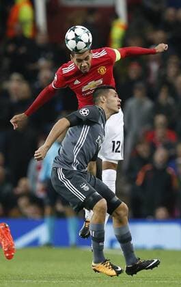 Chris Smalling of Manchester United ManU clears under pressure from Raul Jimenez of SL Benfica during the Champions League Group A match at the Old Trafford Stadium, Manchester. Picture date: October 31st 2017. Picture credit should read: Andrew Yates Sportimage EDITORIAL USE ONLY. No use with unauthorised audio, video, data, fixture lists, club league logos or live services. Online in-match use limited to 120 images, no video emulation. No use in betting, games or single club league player publications.