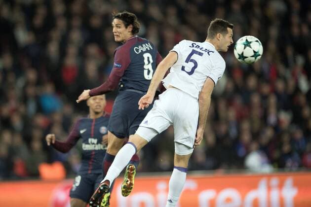 (171101) -- PARIS, Nov. 1, 2017 -- Edinson Cavani (L) from Paris Saint-Germain competes with Uros Spajic from Anderlecht during their UEFA Champions League group B match in Paris, France on Oct. 31, 2017. Paris Saint-Germain won 5-0. ) (SP)FRANCE-PARIS-FOOTBALL-UEFA CHAMPIONS LEAGUE-GROUP B JackxChan 