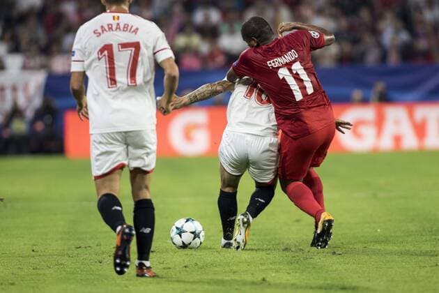 November 1, 2017 - Seville, Spain - Ever Banega of Sevilla (C ) vies for the ball with Fernando of Spartak (R ) during the UEFA Champions League Group E soccer match between Sevilla FC and Spartak Moskva at Estadio Ramon Sanchez Pizjuan Soccer 2017 - Sevilla FC vs Spartak Moskva - ZUMAa142 20171101_zap_a142_012 Copyright: xDanielxGonzalezxAcunax