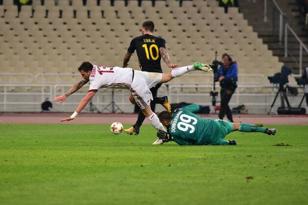 Italy: AEK versus Milan Marko Livaja (no 10) of AEK, tries to pass from Gianluigi Donnarumma (no 99) goalkeeper of Milan who s has contact with Alessio Romagnoli (no 13) of Milan. Athens Attiki Greece OAKA Spiros Louis  DimitriosxKarvountzisx xPacificxPress