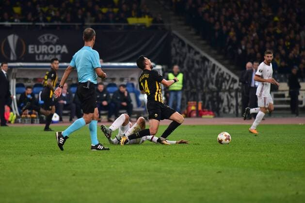 Italy: AEK versus Milan Tasos Bakasetas (no 14) won a foul under the view of the referee. Athens Attiki Greece OAKA Spiros Louis  DimitriosxKarvountzisx xPacificxPress